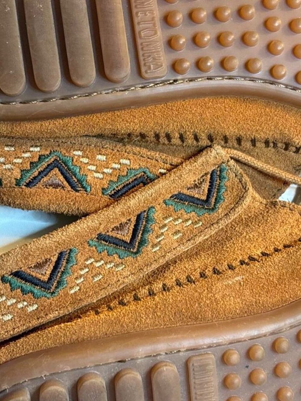 Brand new Minnetonka brown suede moccasin with geometric embroidery
